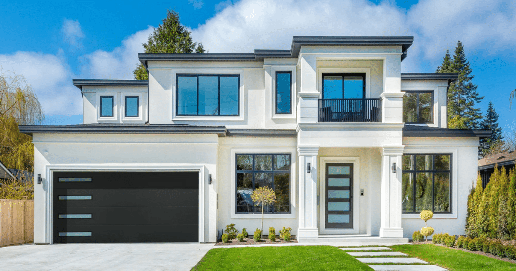 black garage doors on white house
